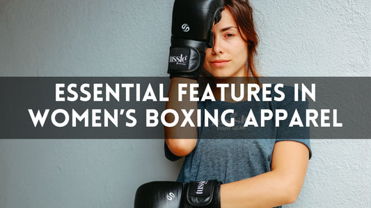 Female boxer wearing Tussle boxing gloves and athletic apparel, standing confidently against a wall with text overlay reading “Essential Features in Women’s Boxing Apparel.”