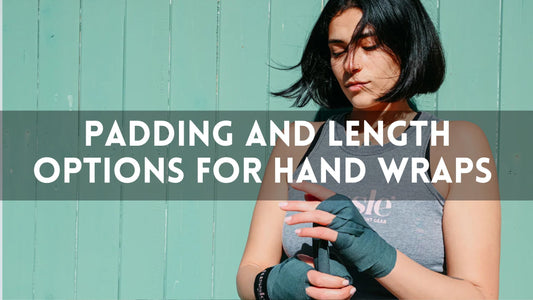 A woman in a gray tank top wraps her hands with teal boxing wraps in front of a light teal wooden wall. Text overlay reads: “Padding and Length Options for Hand Wraps.”